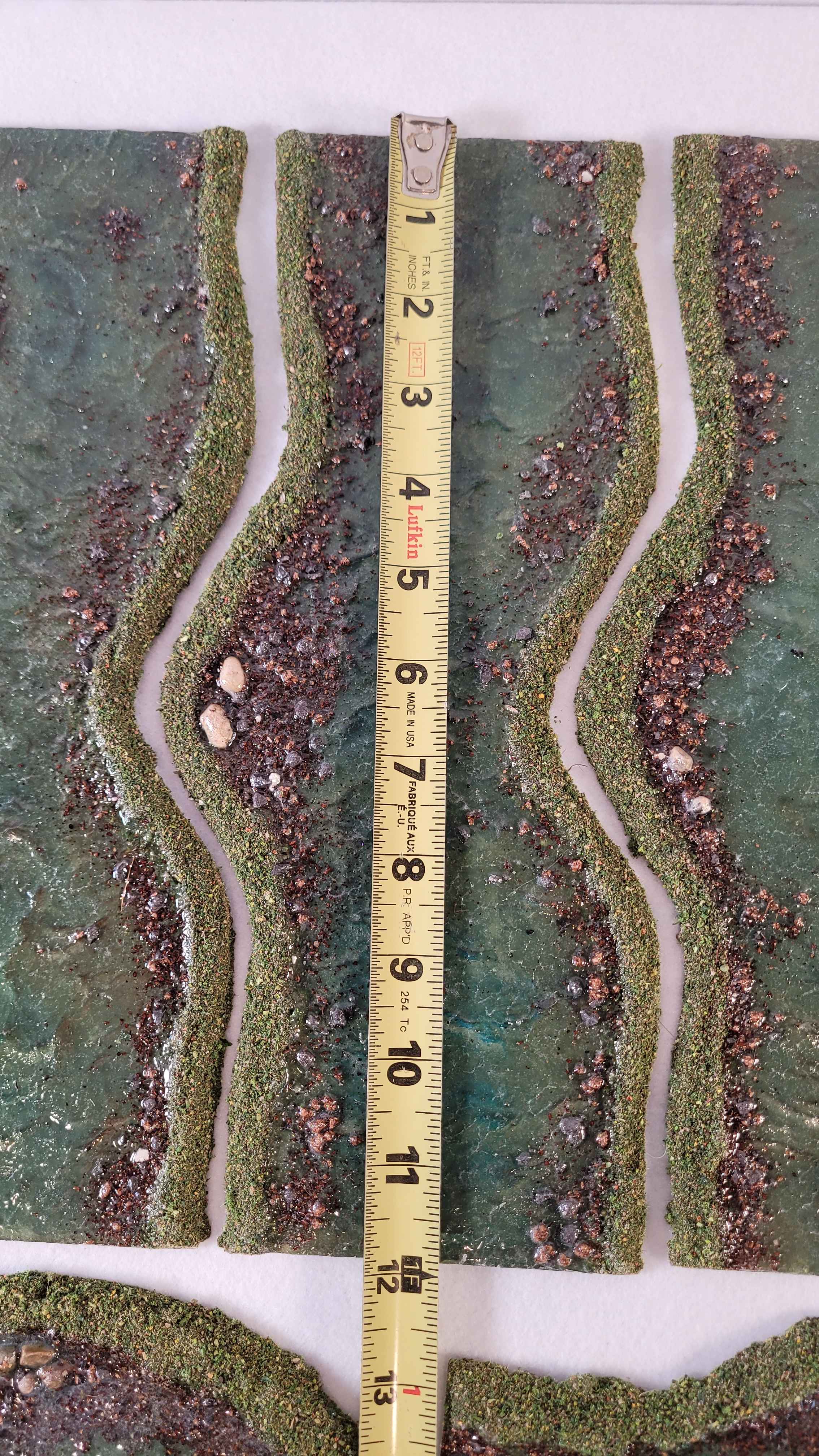 Modular river straight sections approximately 12 inches long with textured banks