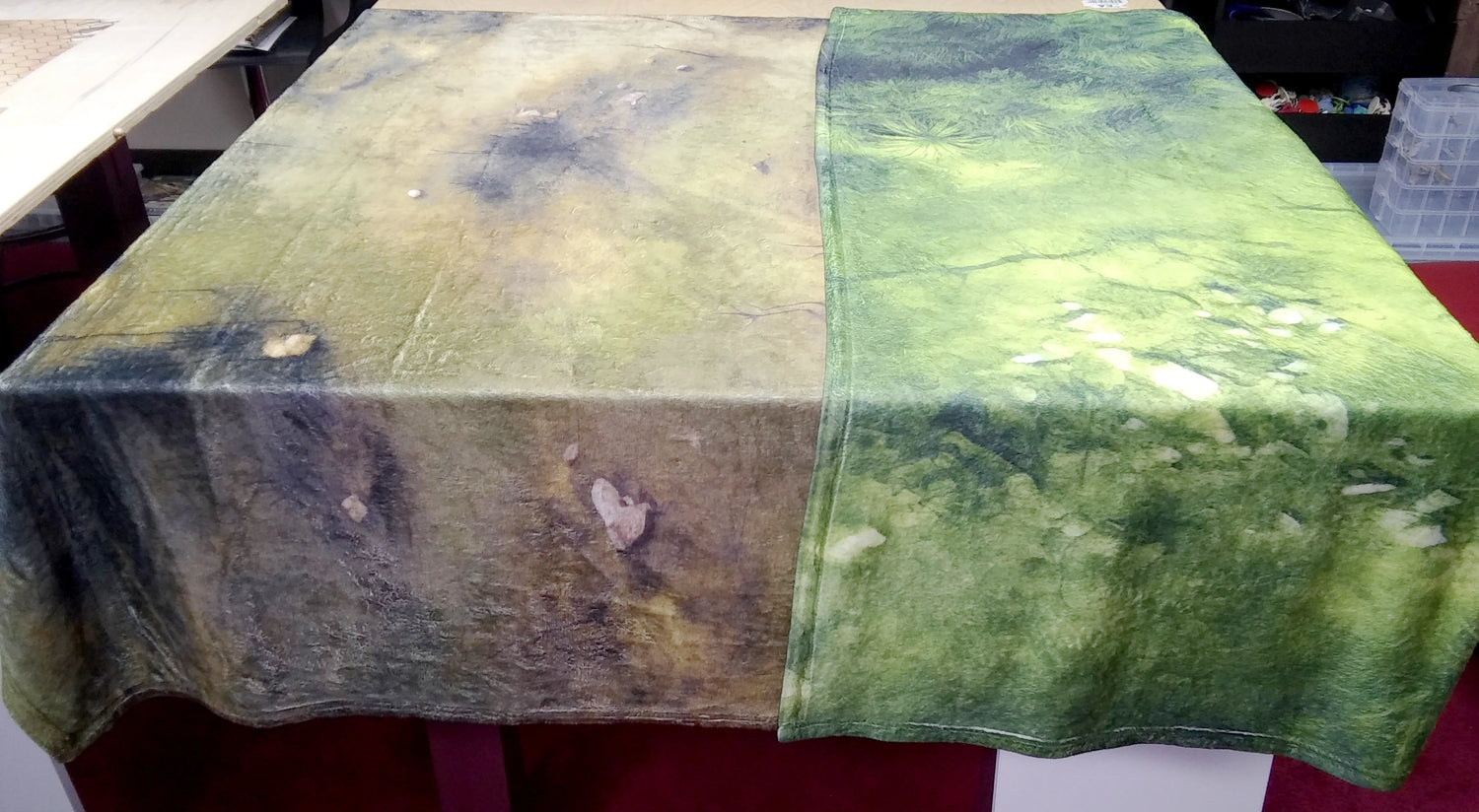 a table with a green and brown table cloth on it