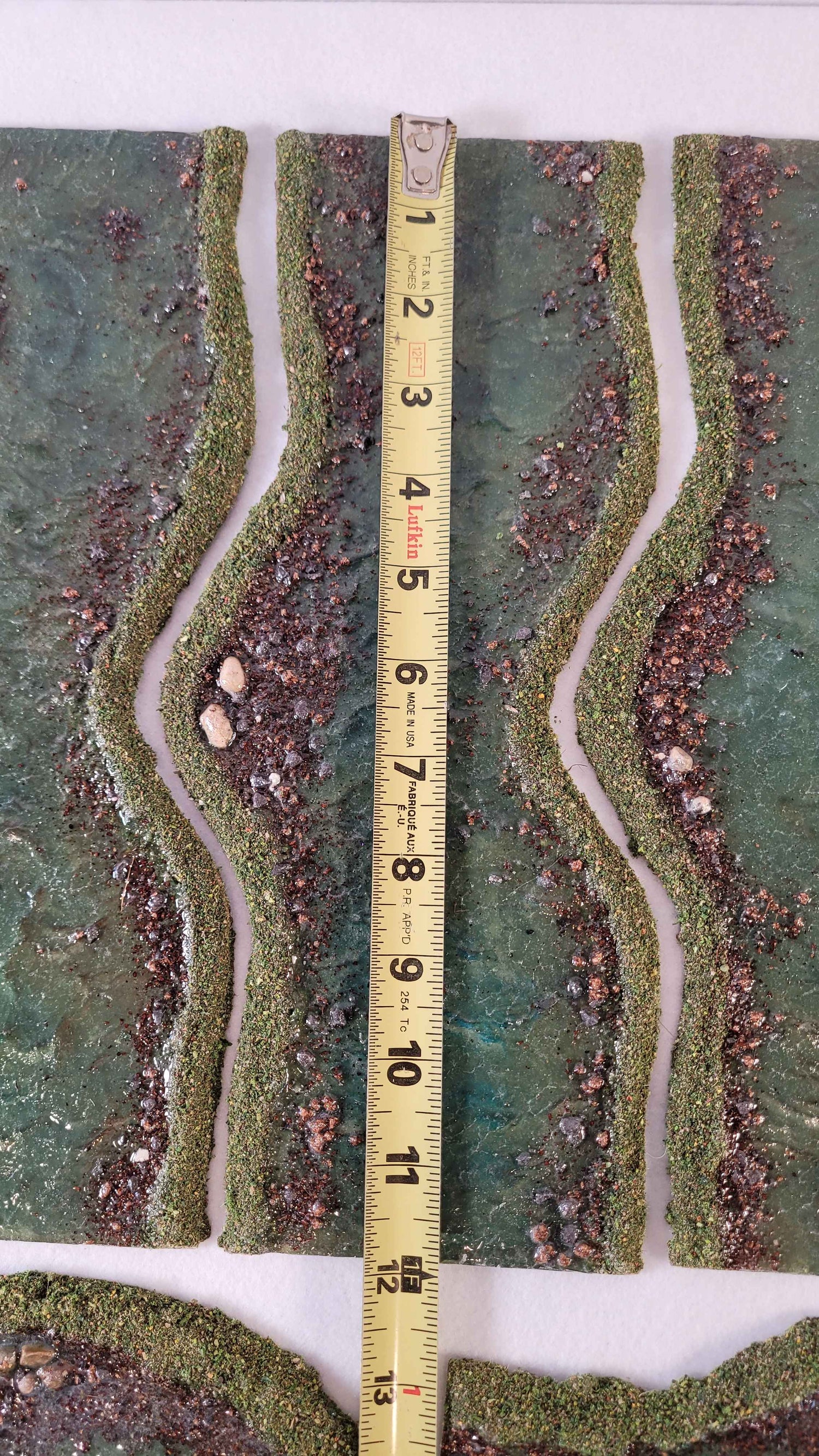 Modular river straight sections approximately 12 inches long with textured banks