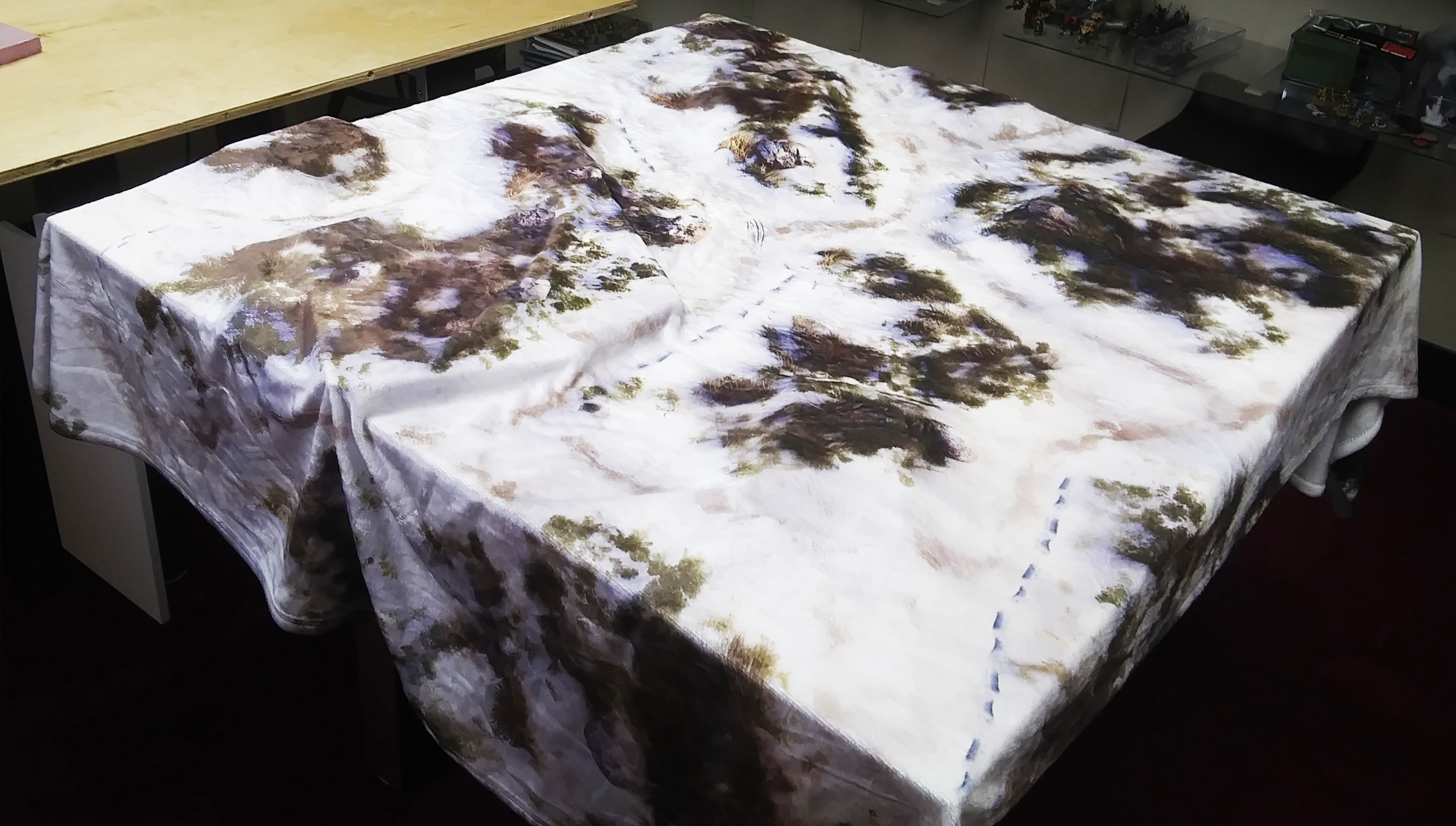 a table with a white and brown tablecloth on it