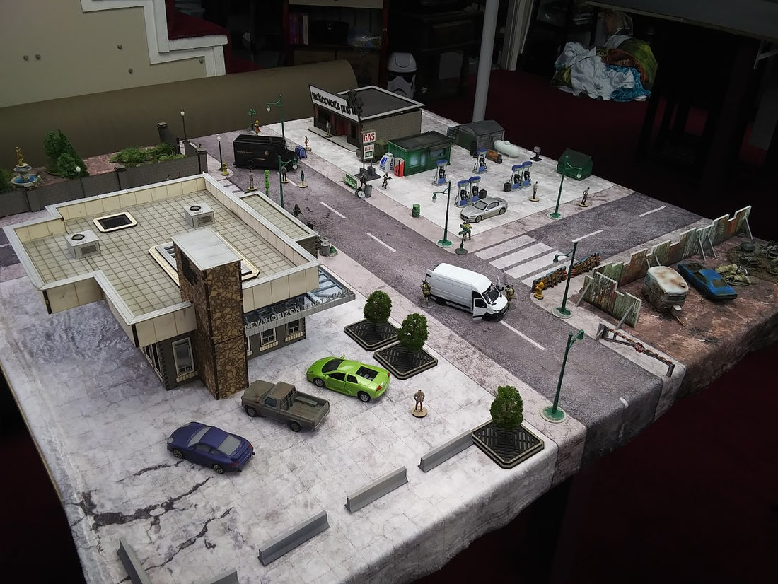 a model of a building with cars parked in front of it