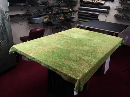 a table with a green table cloth on it