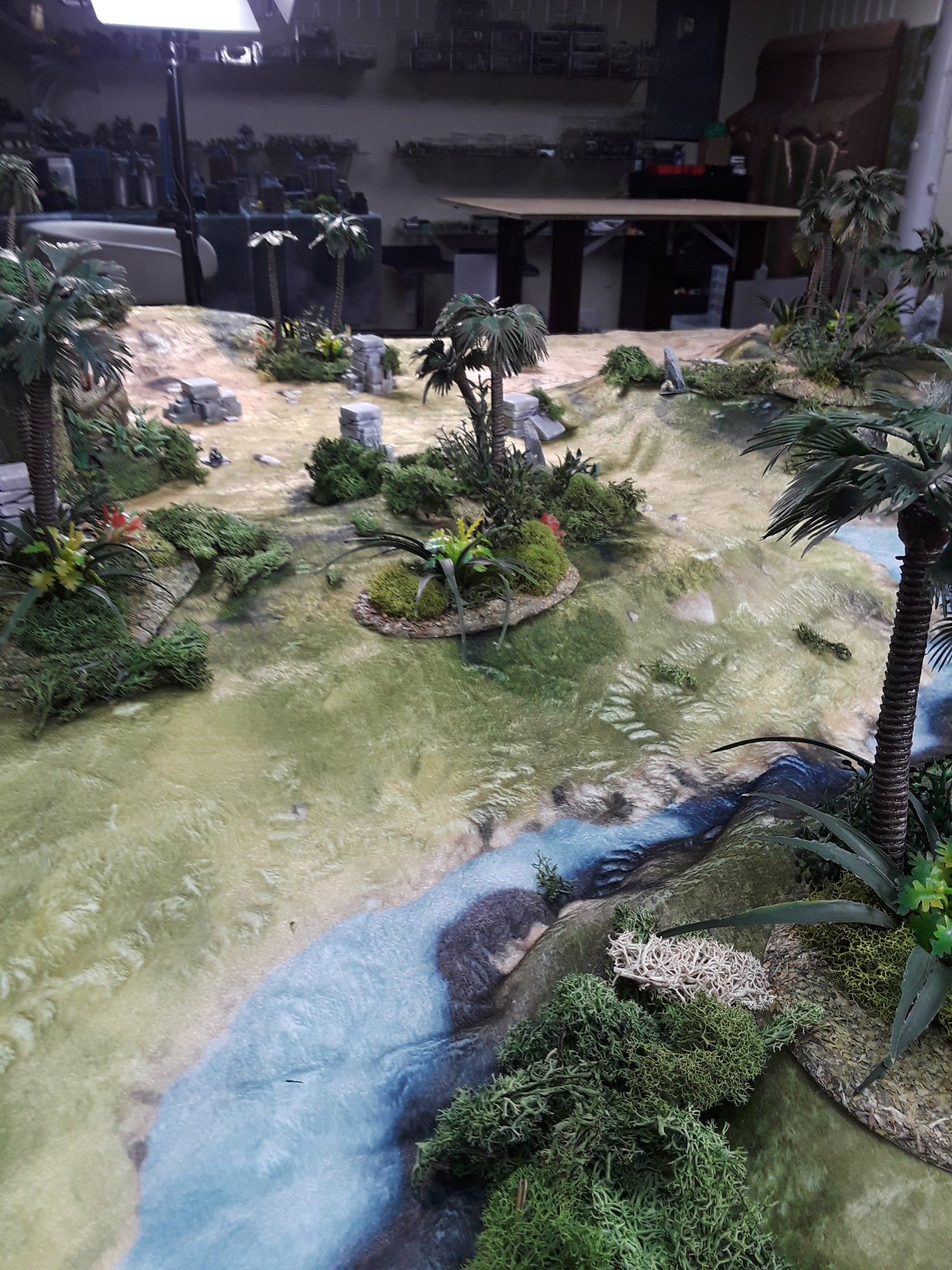 a model of a river running through a forest