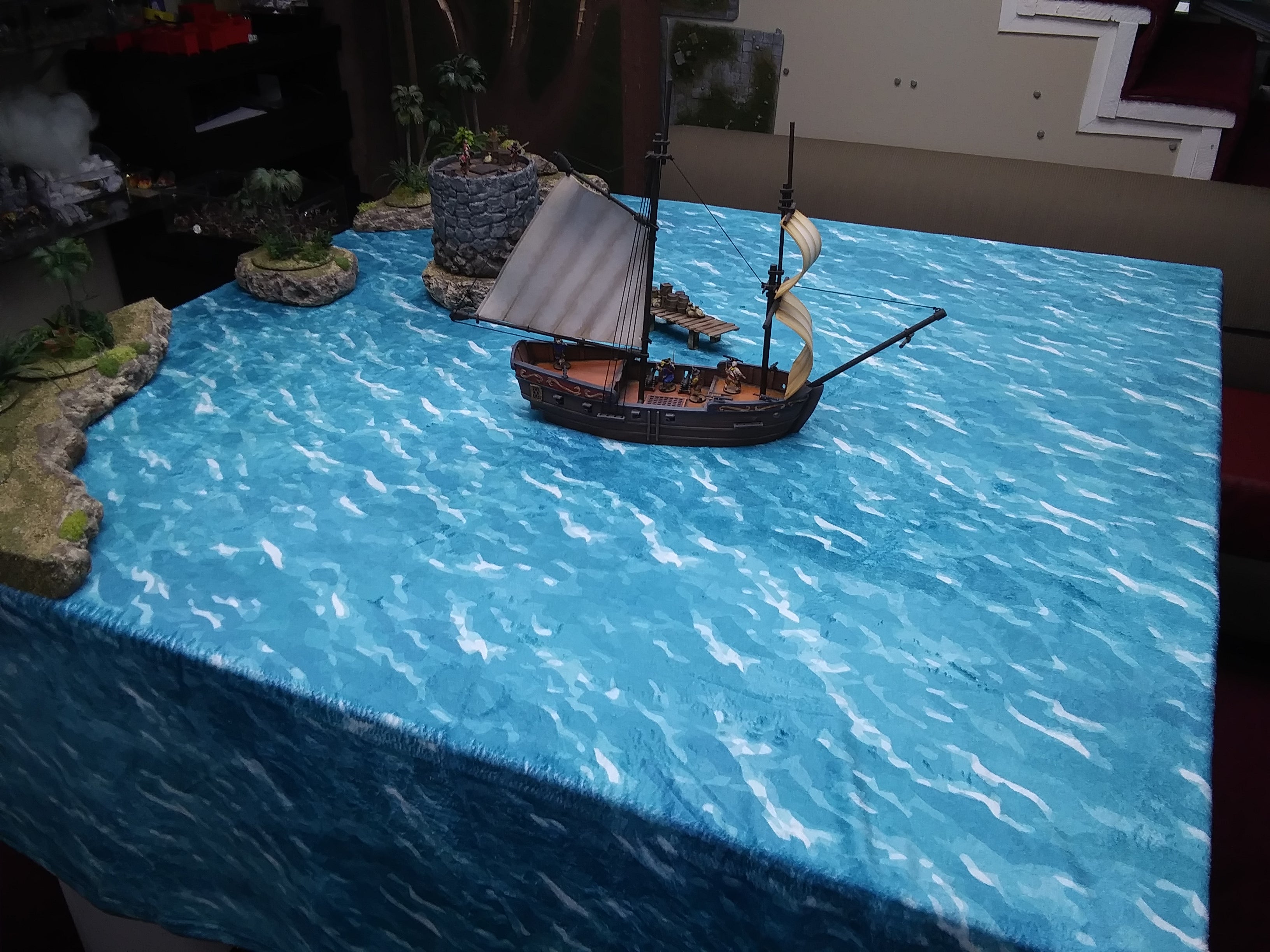 a model of a boat on a blue table